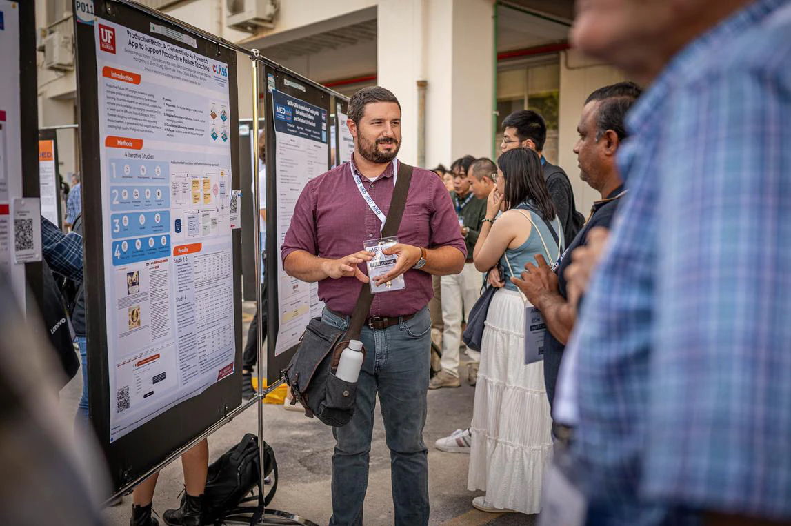 Dr. Botelho presenting ProductiveMath poster